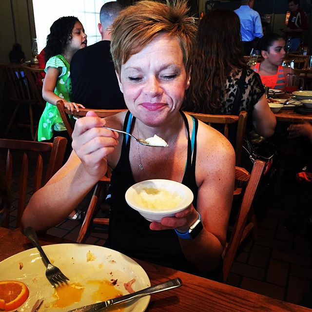 Pam, eating grits.